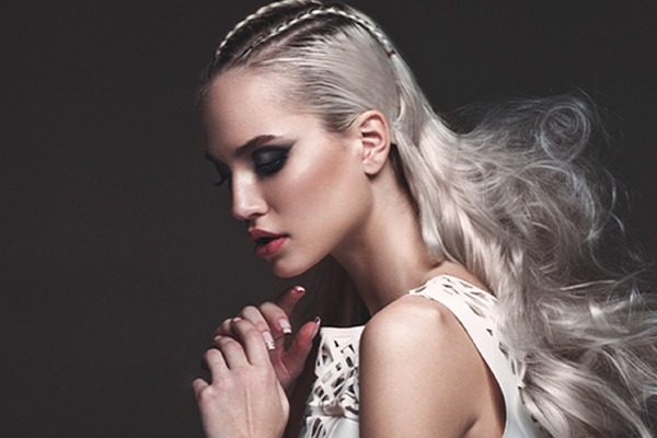 Woman with long white hair looking down